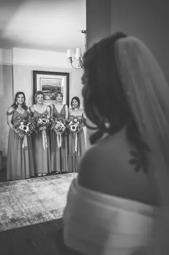 Black and white bridal reveal with bridesmaids at Millbrook Lodge, Ballynahinch
