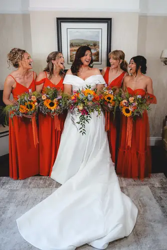 Bride and bridesmaids with bouquets during the wedding morning at Millbrook Lodge, Ballynahinch