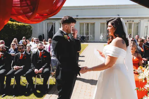 Emotional groom during outdoor wedding vows at Millbrook Lodge in Ballynahinch