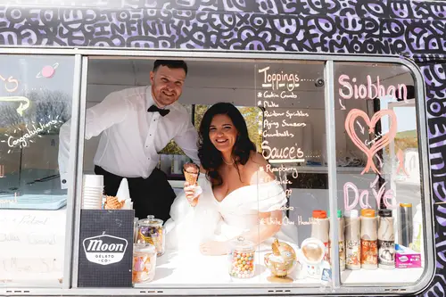 Bride and groom enjoying ice cream and champagne in the spring sunshine at Millbrook Lodge, Ballynahinch