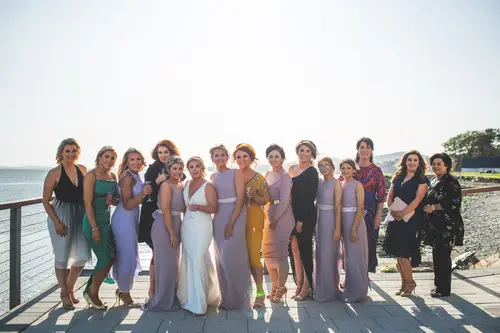 Sunny bridal party and family portraits by the waterfront at Redcastle Hotel in Moville