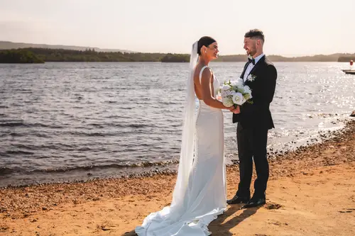 Bride and groom in golden hour couple portraits by the lakeside at Rossharbour Resort, Lough Erne