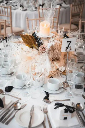 Candlelit wedding tablescape with floral details and place settings at Rossharbour Resort, Lough Erne