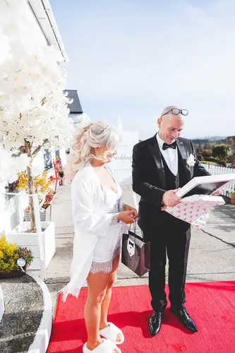 Bride in a robe during wedding morning preparations at Rossharbour Resort, Lough Erne, captured in bright natural light