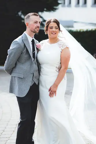 Bride and groom in a flowing veil during outdoor couple portraits at Stormont, Belfast