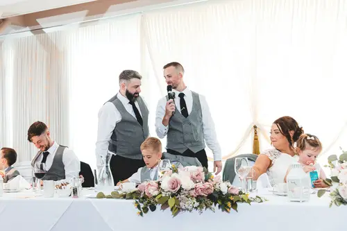 Groom giving his speech at the top table during a joyful Stormont wedding reception in Belfast
