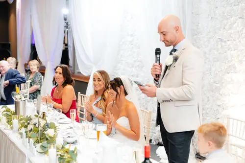 Groom giving his speech at the top table during a bright Ten Square wedding reception in Belfast