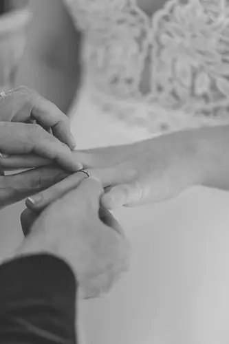 Black and white close-up of wedding rings exchanged during a ceremony at Ulster Museum in Belfast